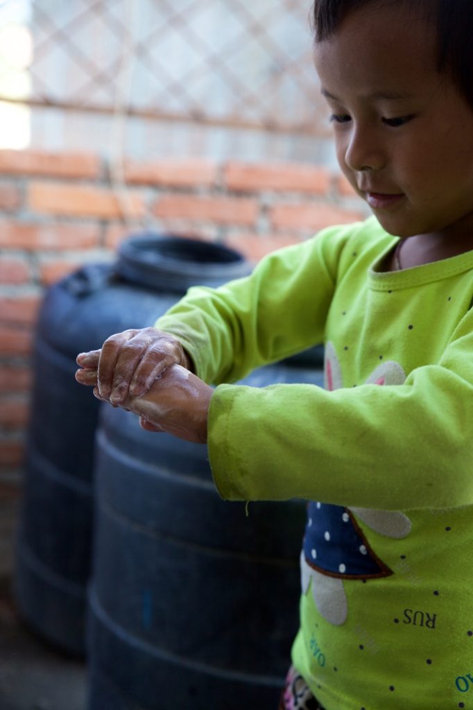 Rasmina practices washing her hands with soap after being taught about hygiene and sanitation practices upon discharge from Dhulikhel Hospital. Photo Credit: Mithila Jariwala