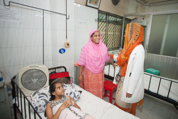 Suraya Begum, Nurunnahar’s mom, beams with happiness as Dr. Shoma sends Nurunnahar home after two weeks of illness.