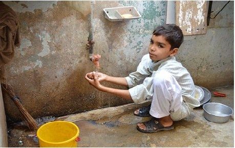 Asim scrubs his hands with soap and water after coming back from playing with his friends. 