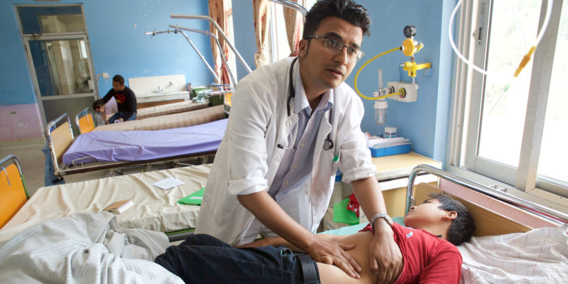 Dr. Shrestha treats a pediatric typhoid patient, Nepal