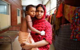 Samir, six, is cradled in the arms of his mother, Hasina Akhter. A housewife, she is now searching for a way to earn money to pay Samir’s medical bills.