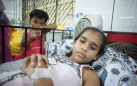 Nurunnahar had to miss school for two weeks with a case of typhoid that sent her to the hospital. One of her younger siblings is seen here watching over her hospital bed.