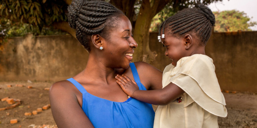 Mother holding her daughter, Kenya. Typhoid is endemic to Kenya