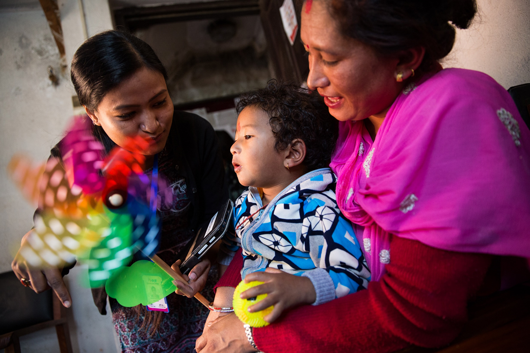 Trial staff have many tasks, including distracting children with toys, candy, or bright objects to reduce their distress during vaccination.