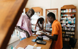 People purchase medication at the Pharmacie Bakh Yaye in Thies, Senegal. PATH