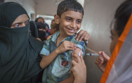 Photo shows boy in Pakistan receiving TCV