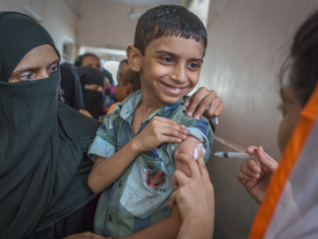 Photo shows boy in Pakistan receiving TCV