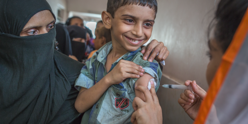 Photo shows boy in Pakistan receiving TCV