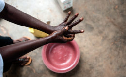 Health worker washes her hands