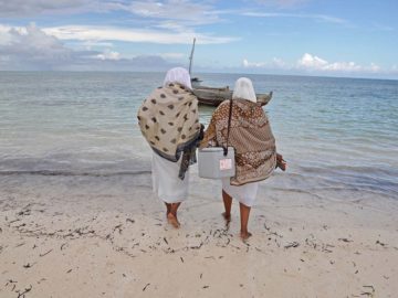 Health care workers delivering vaccines in Tanzania