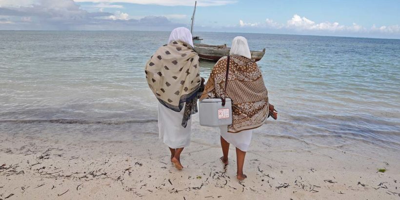 Health care workers delivering vaccines in Tanzania