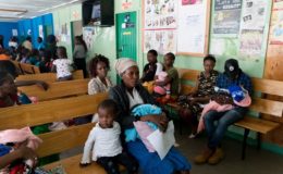 Angela Godfrey, age 26, and her daughter Sara Kambua, age 5, wait in the health clinic in Mukuru, Kenya, February 5, 2018.