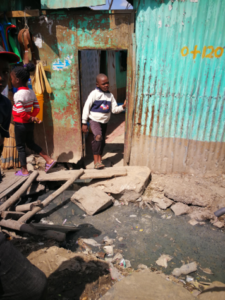 temporary housing and open sewer in Mukuru, Kenya