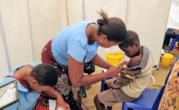 Health care worker administers TCV to a boy as part of the TCV trial in Malawi