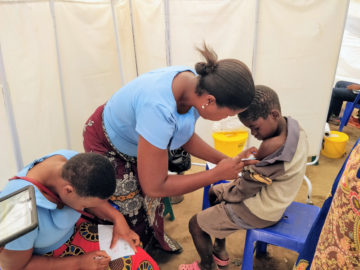 Health care worker administers TCV to a boy as part of the TCV trial in Malawi