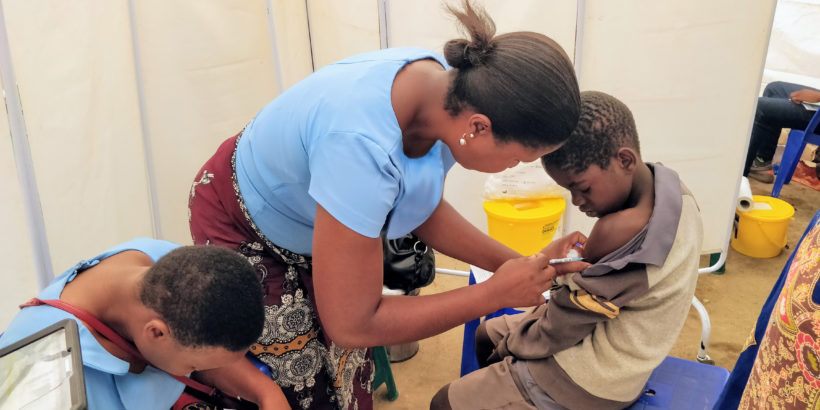 Health care worker administers TCV to a boy as part of the TCV trial in Malawi