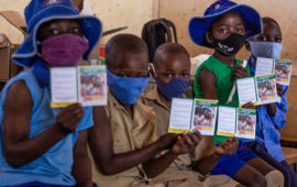 Group of children wait to get vaccinated with TCV