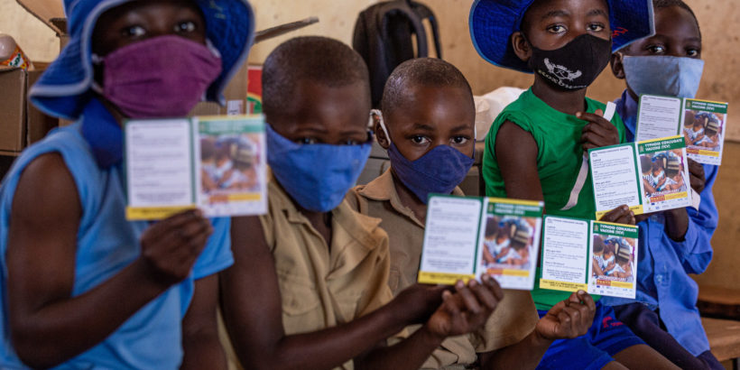 Group of children wait to get vaccinated with TCV