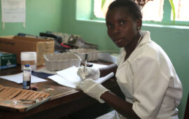 Nurse in Malawi works in lab. STRATAA