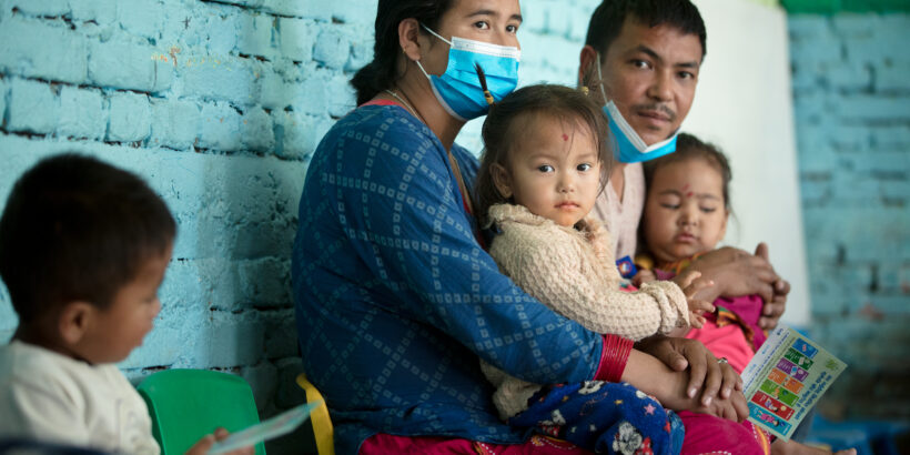 parents with their children as they are vaccinated with TCV