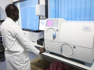 A photo showing a laboratory technician