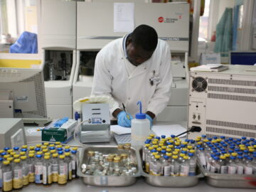 TyVAC Malawi vaccine efficacy trial - technician with vaccine vials