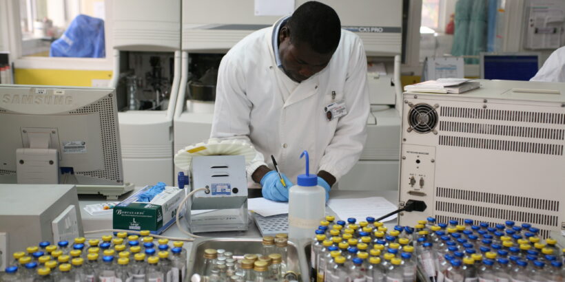 TyVAC Malawi vaccine efficacy trial - technician with vaccine vials