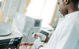 A laboratory worker performs diagnostic tests