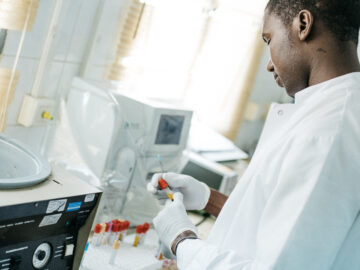 A laboratory worker performs diagnostic tests