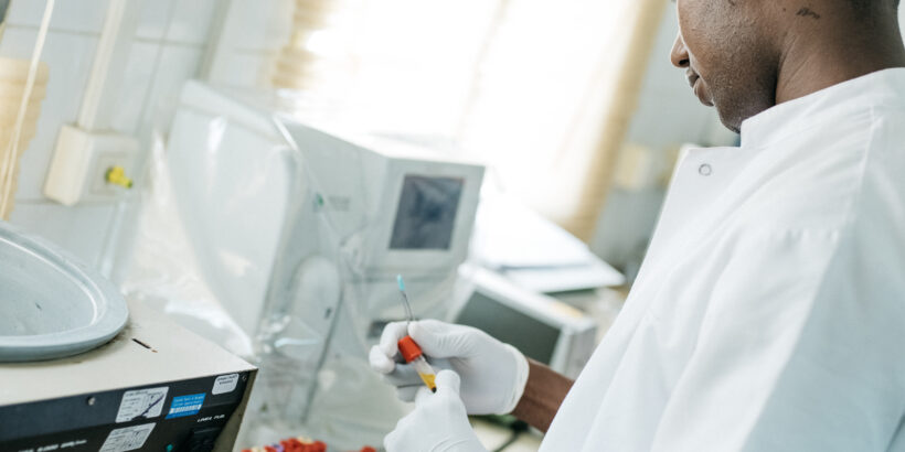 A laboratory worker performs diagnostic tests