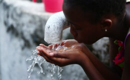 A child drinking water in Liberia
