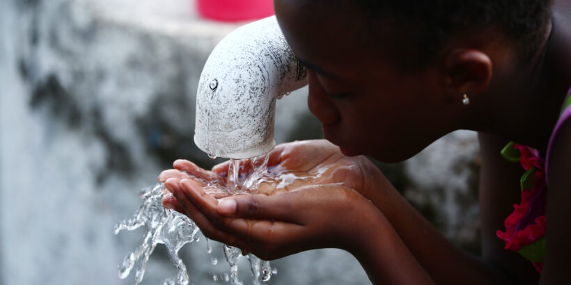 A child drinking water in Liberia