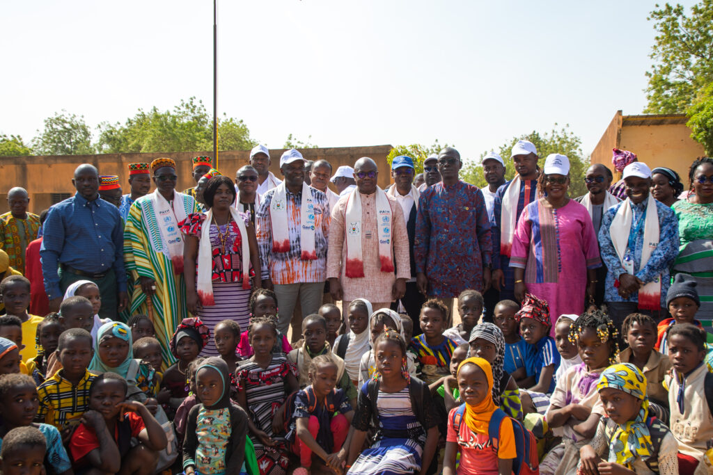 Burkina Faso Minister of Health Robert Lucien Kargougou stands with children and country leaders at the launch of the country’s TCV introduction campaign. 