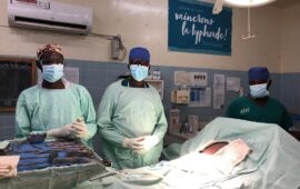 Three surgeons at the hospital in Galmi, Niger, stand in the operating room ready to treat patients with typhoid intestinal perforation.