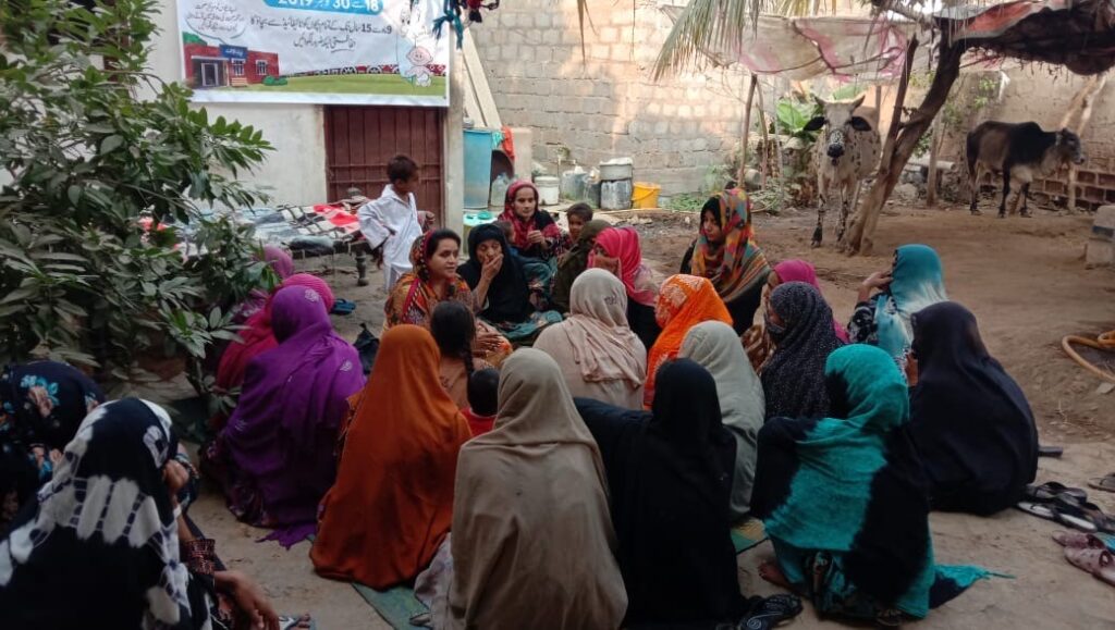 Women participate in an educational meeting on TCV in Sindh Province, Pakistan, in 2019. 