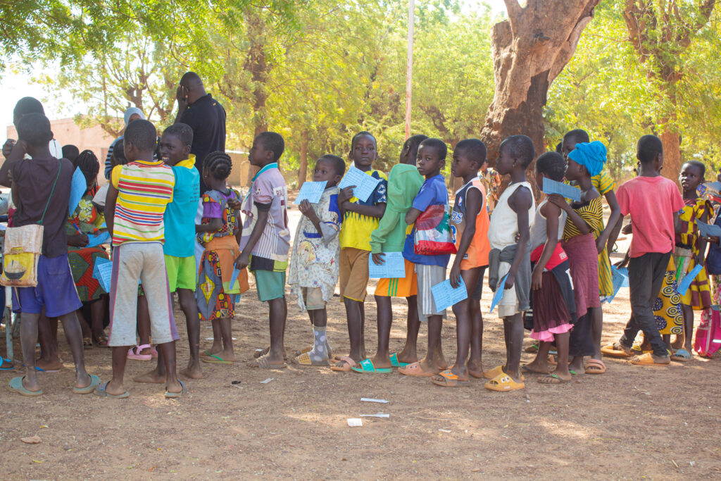 Children line up to receive TCV in Burkina Faso during the country’s TCV introduction campaign in January 2025.
