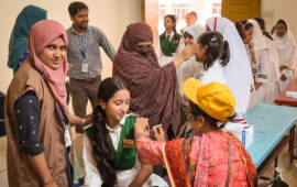 A vaccinator administers TCV during Bangladesh’s introduction campaign in fall 2025.