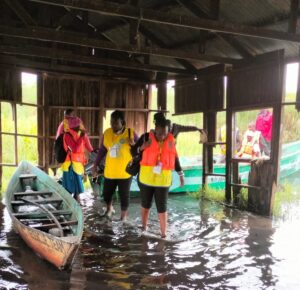 Vaccination teams in Busia County, Kenya, traveled by boat to reach Madua Primary School during Kenya’s TCV introduction campaign in July 2025.