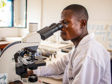 Mukizi Kabela-Kondo, a laboratory technician at Kenge General Hospital in the Democratic Republic of the Congo, performs the Widal test, which detects the presence of antibodies against Salmonella typhi, the bacteria causing typhoid.