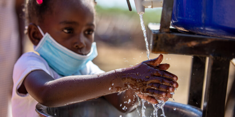 A girl washes her hands during Zimbabwe’s TCV introduction campaign in 2021. Zimbabwe and other countries have been affected by flooding in recent months.