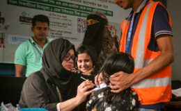 A health worker delivers typhoid conjugate vaccine (TCV) during Bangladesh's introduction campaign.