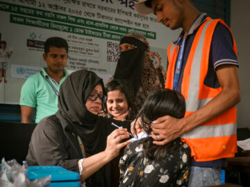 A health worker delivers typhoid conjugate vaccine (TCV) during Bangladesh's introduction campaign.