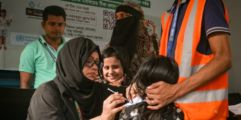 A health worker delivers typhoid conjugate vaccine (TCV) during Bangladesh's introduction campaign.
